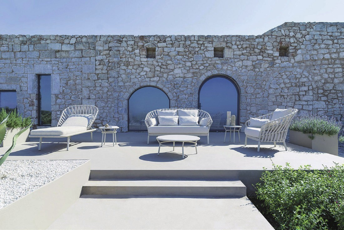 Outdoor sunlounger, sofa, and armchairs.